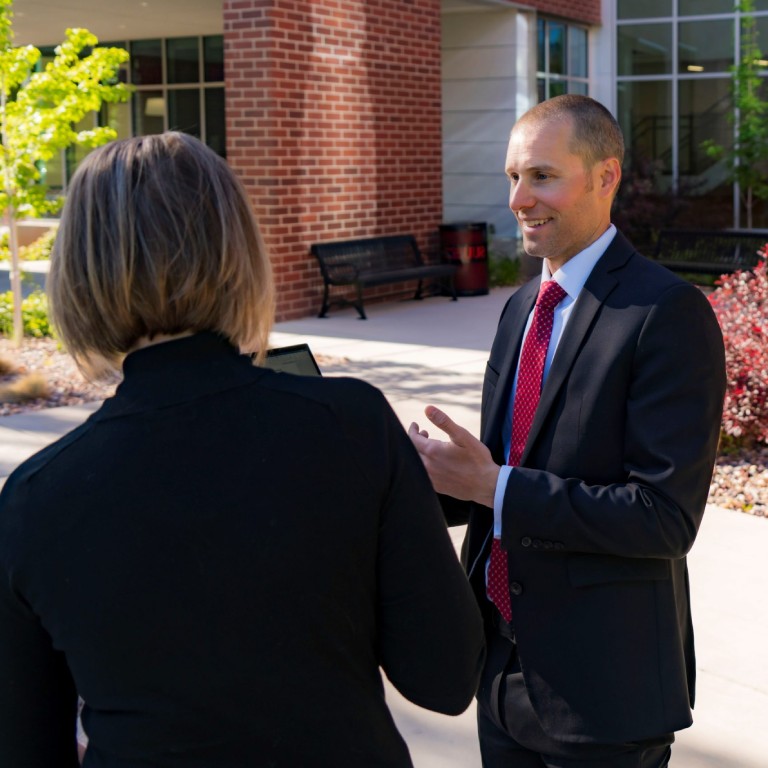 kevin rasmussen talking with client